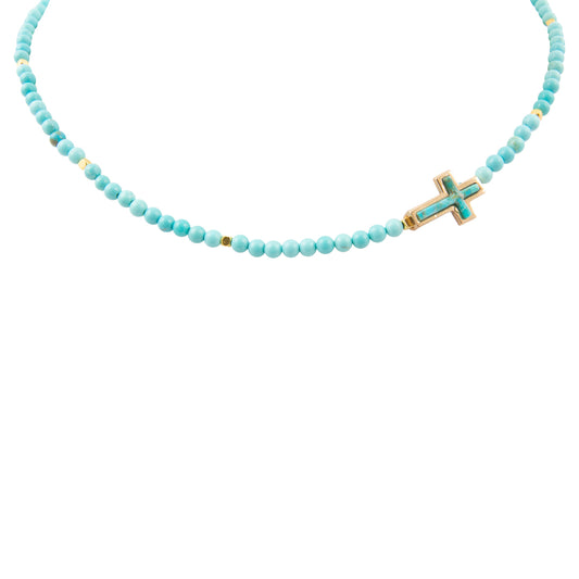 Necklace with turquoise beads and a cross pendant on a white background