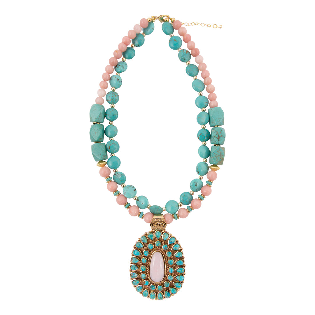 Necklace with turquoise and pink beads on a white background