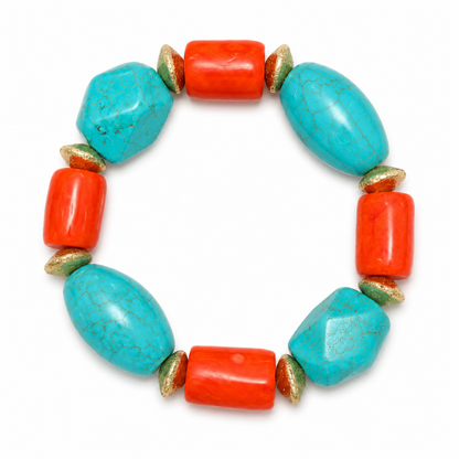 A beaded stretch bracelet featuring large turquoise-blue oval beads, bright coral-red cylindrical beads, and small metallic gold leaf-shaped spacer beads, arranged in a circle on a white background.