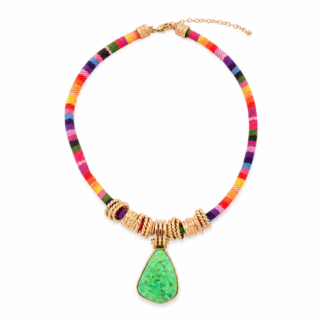 Colorful beaded necklace with a green pendant on a white background