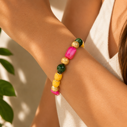 Colorful beaded bracelet on a person's wrist with a neutral background