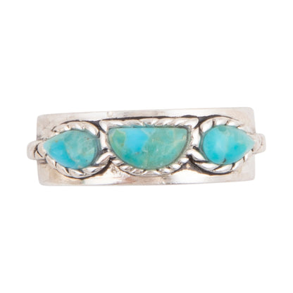 A silver ring featuring three marquise-cut light blue turquoise stones set in a textured, twisted silver band, shown against a plain white background.