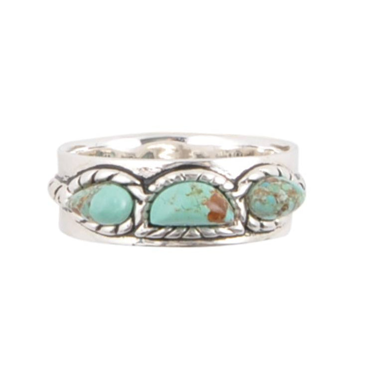 Silver ring with turquoise stones on a white background