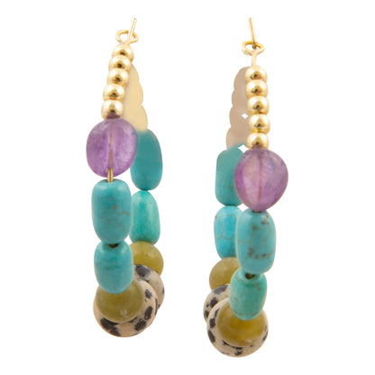 A pair of bohemian-style dangle earrings featuring turquoise, purple amethyst, olive green, and black-and-white spotted agate beads with gold-tone metal findings, shown against a plain white background.