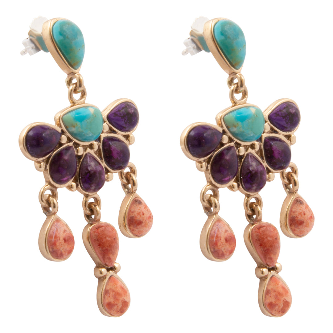 Pair of earrings with turquoise, purple, and red stones on a white background