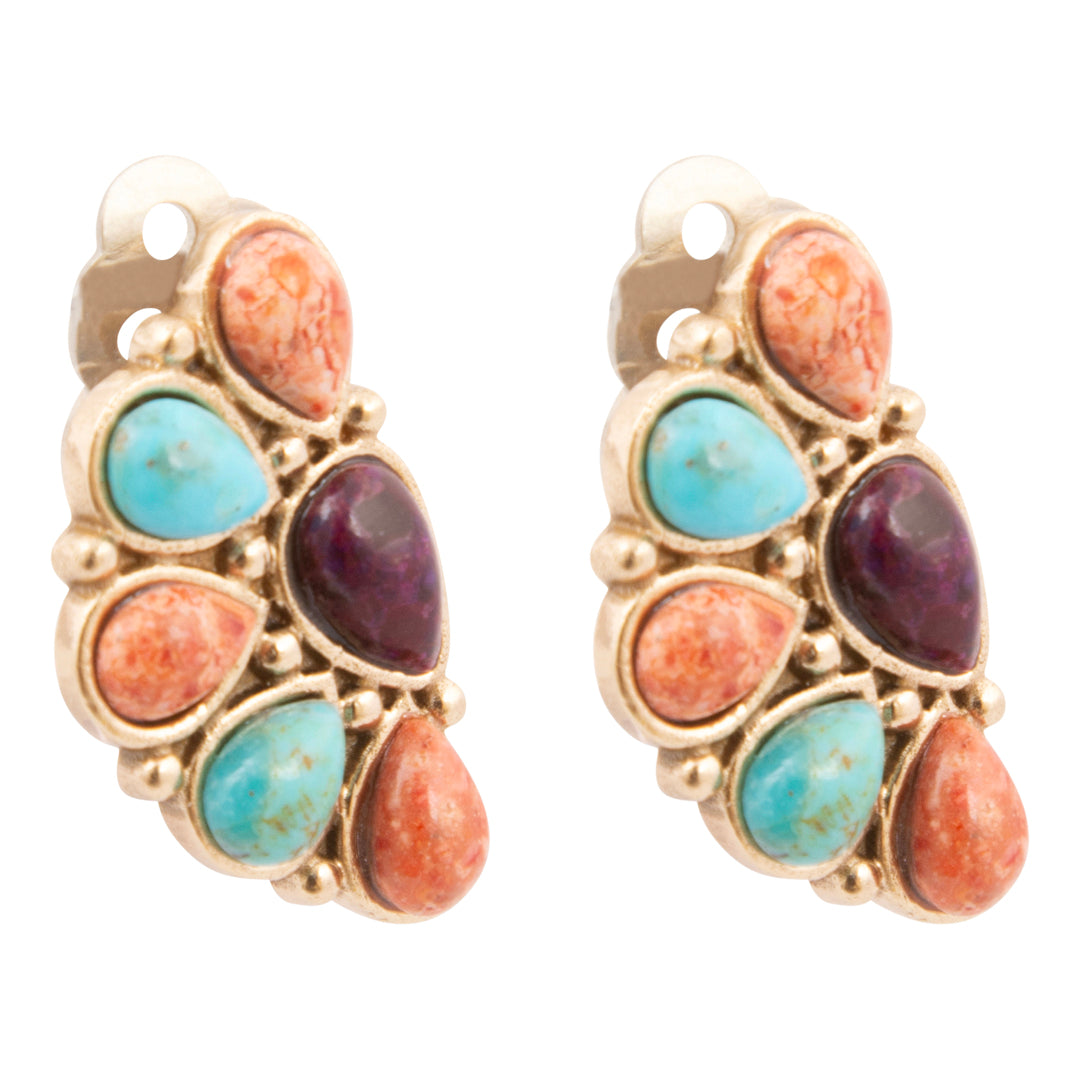 Pair of earrings with gold frame, turquoise, and red stones on a white background