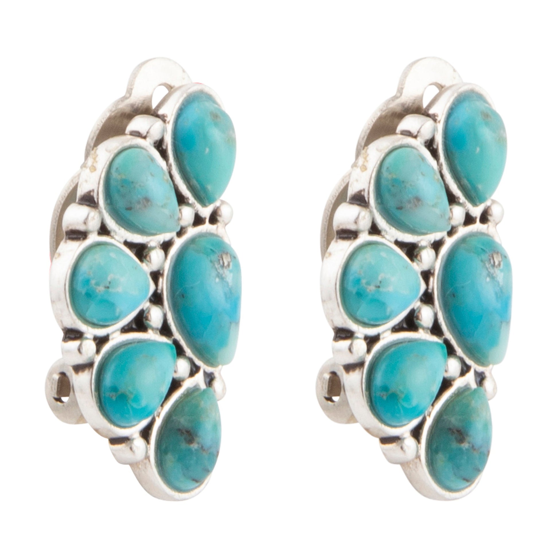 Turquoise stone earrings with silver setting on a white background