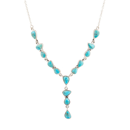 Turquoise necklace with silver chain on a white background