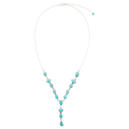 Turquoise beaded necklace on a white background