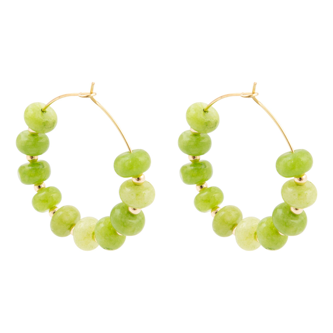 Pair of green beaded hoop earrings on a white background
