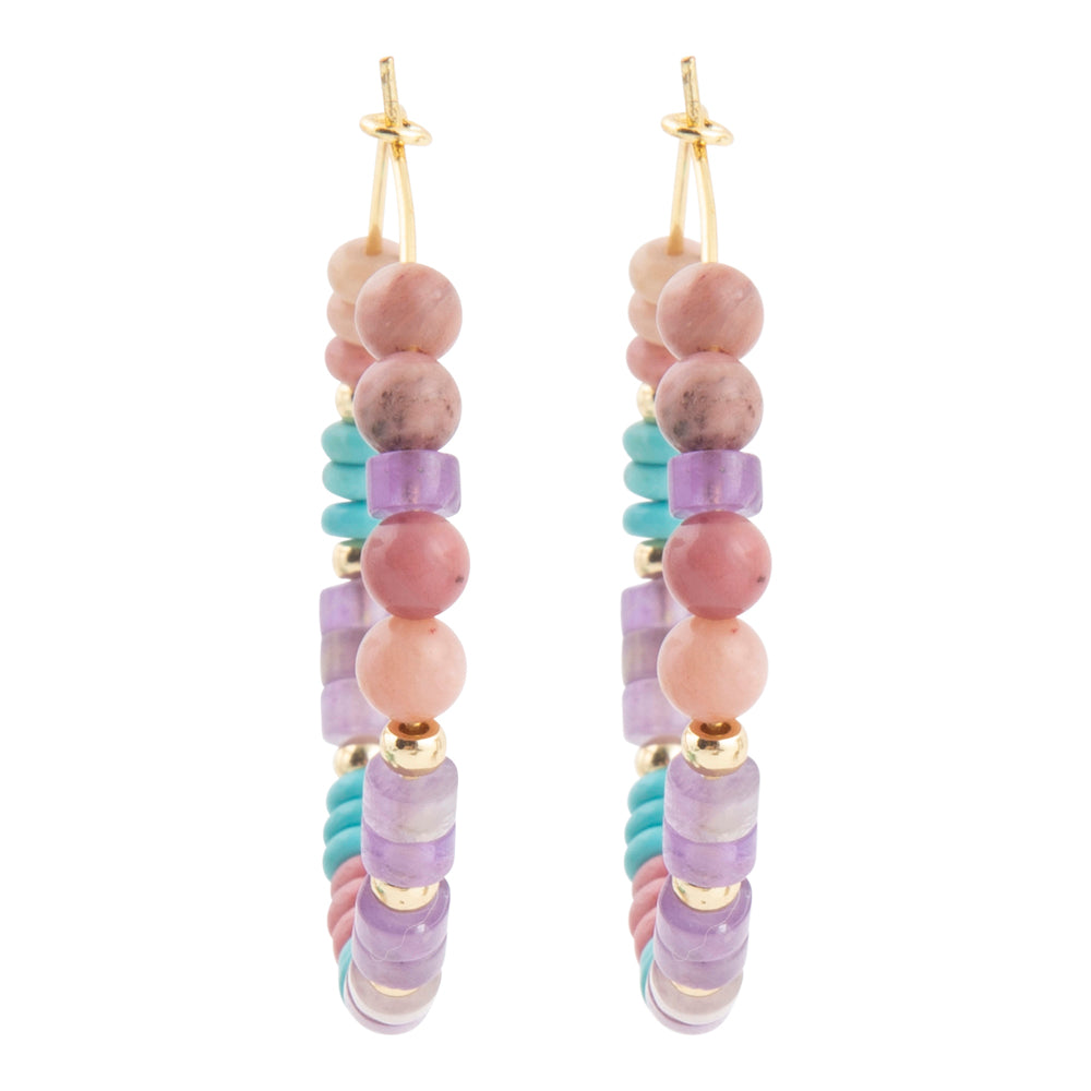 A pair of long beaded drop earrings with gold-tone hooks, featuring pink and lavender beads, light blue beads, and small gold spacer beads on a white background.