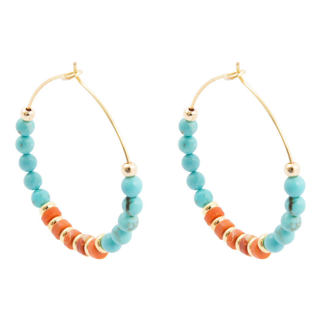 Hoop earrings with turquoise and orange beads on a white background