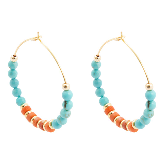 Hoop earrings with turquoise and orange beads on a white background