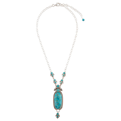Turquoise pendant necklace on a white background