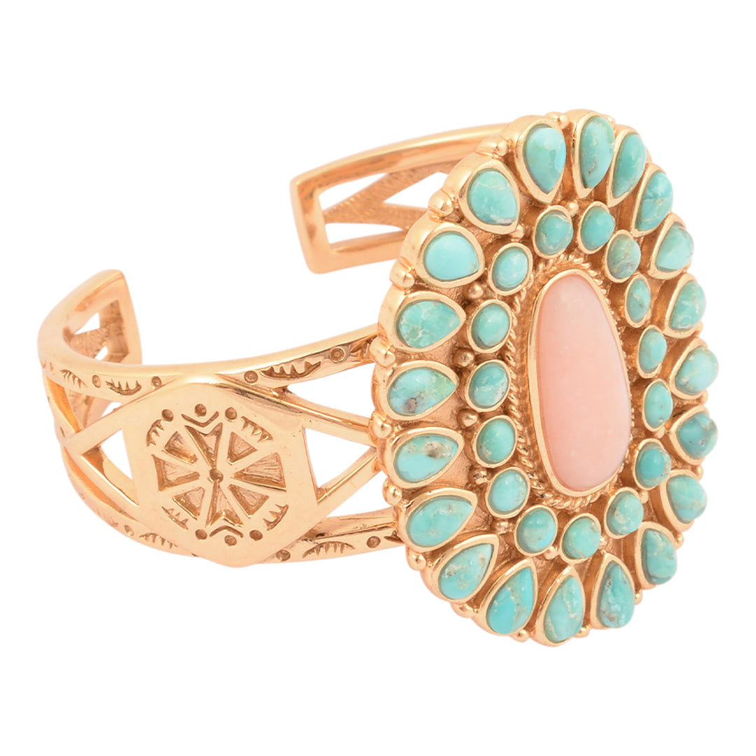 Gold bracelet with turquoise stones on a white background