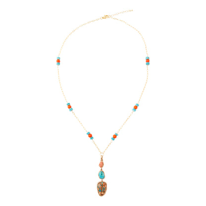 A gold chain necklace with turquoise and orange bead accents and a large oval turquoise pendant, displayed on a clean white background.
