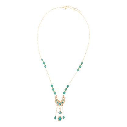 A gold-tone necklace featuring a crescent moon pendant embellished with turquoise-colored stones, flanked by matching turquoise bead drops on a delicate gold chain, set against a plain white background.