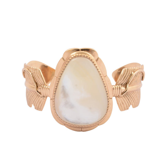 Rose gold ring with a large teardrop-shaped stone on a white background