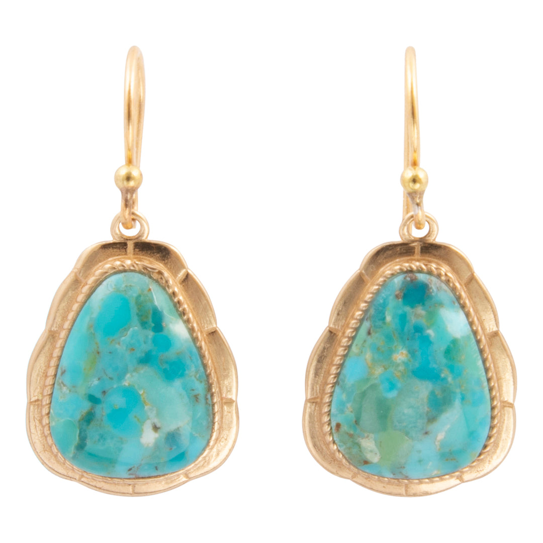A pair of gold drop earrings featuring scalloped teardrop-shaped turquoise stone bezels, shown against a plain white background.