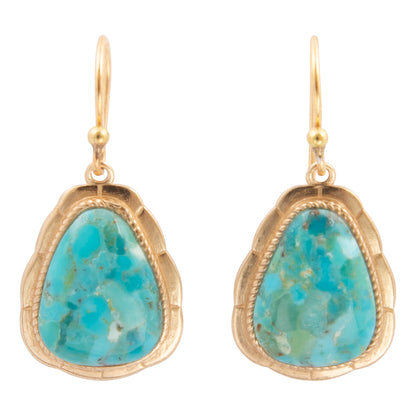A pair of gold drop earrings featuring scalloped teardrop-shaped turquoise stone bezels, shown against a plain white background.