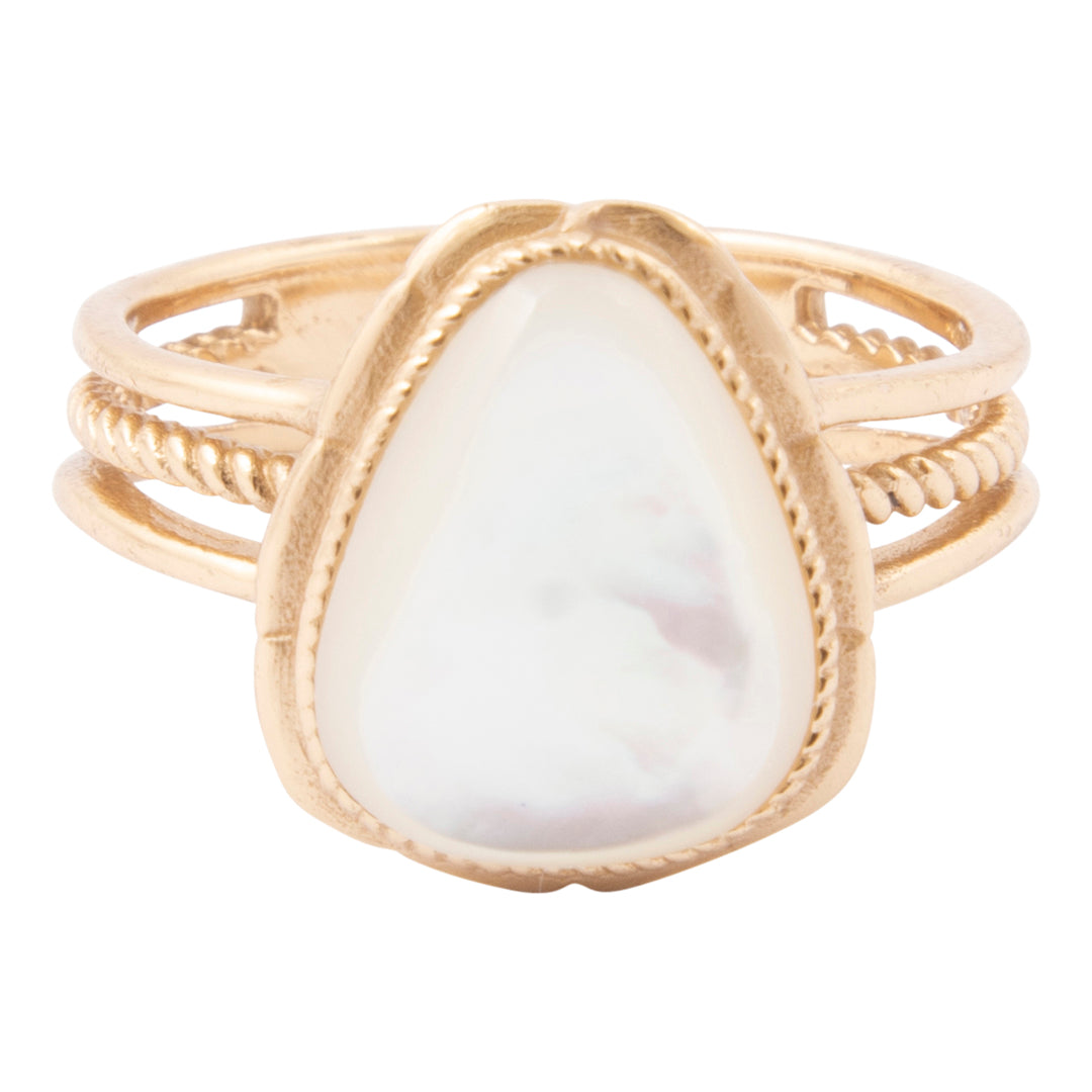 Gold ring with a large white stone on a white background