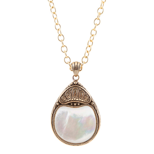 A gold chain necklace with a teardrop-shaped pendant featuring an iridescent white mother-of-pearl center and ornate gold filigree detailing at the top, shown against a plain white background.