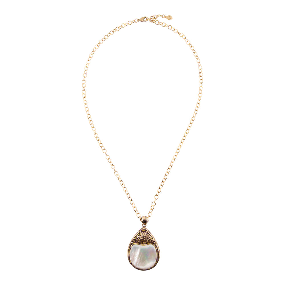 A delicate gold chain necklace featuring a teardrop-shaped pendant with a white mother-of-pearl center and ornate gold filigree detailing at the top, shown against a plain white background.