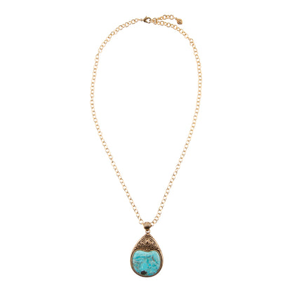 A gold chain necklace with a teardrop-shaped pendant featuring a light blue marbled stone in an ornate gold setting, shown against a plain white background.