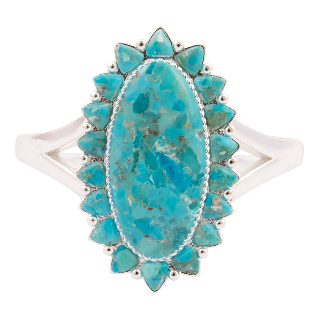 Turquoise ring with silver accents on a white background