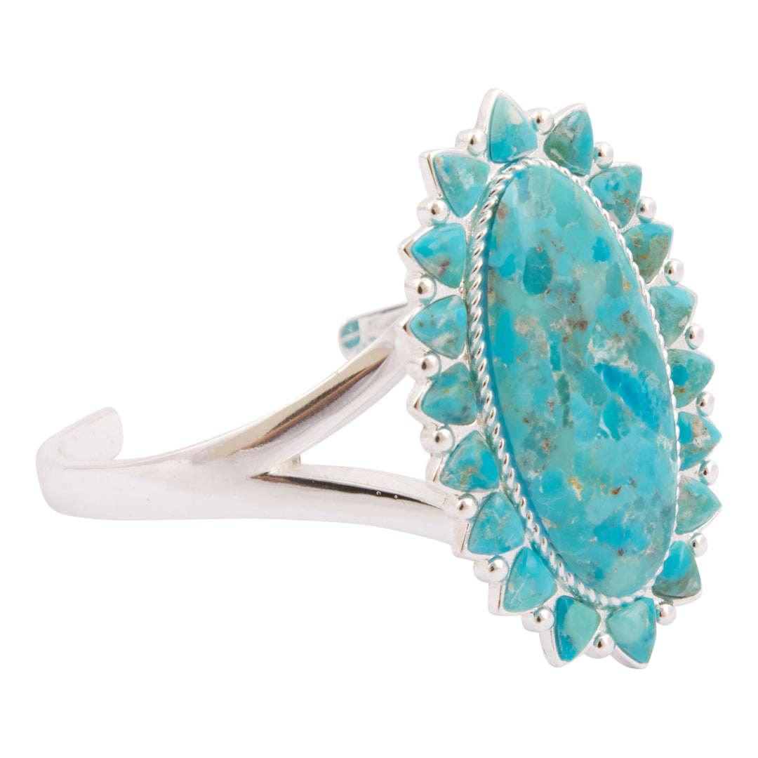 Turquoise ring with silver band on a white background