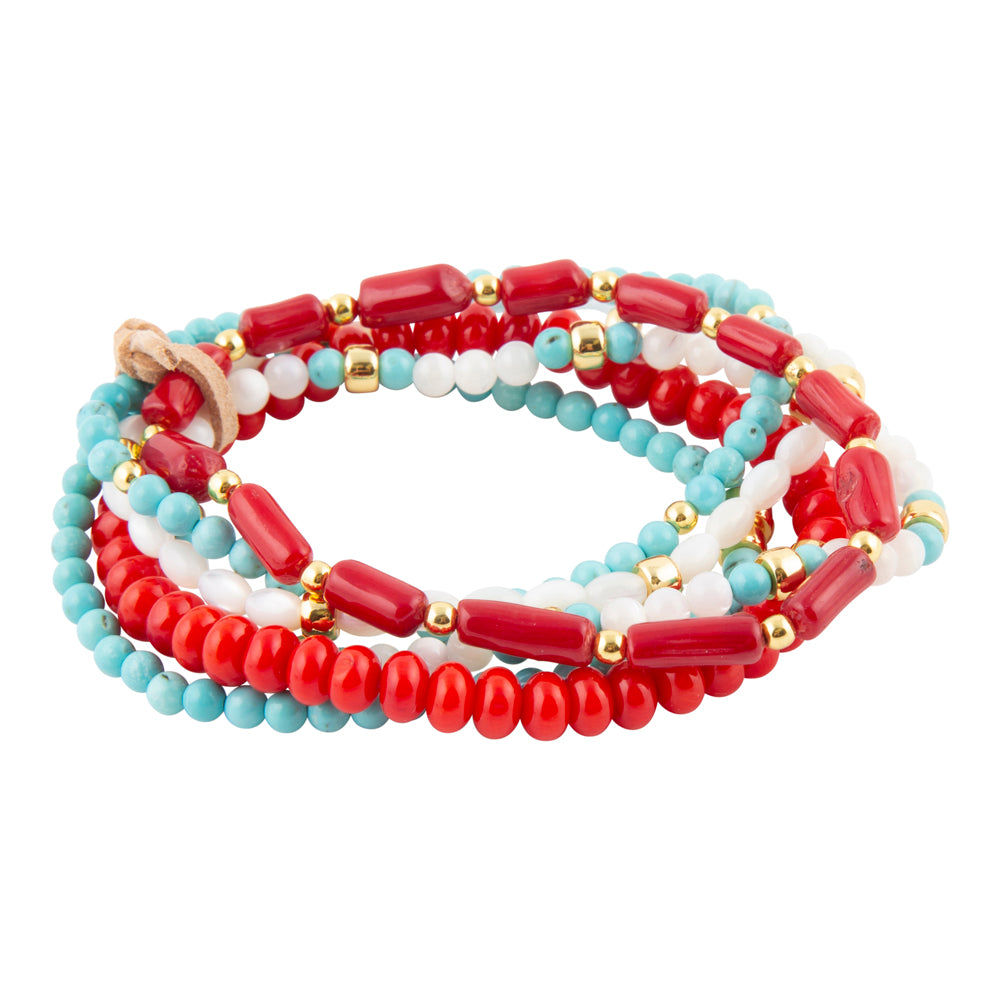 Set of beaded bracelets in red, blue, and white on a white background