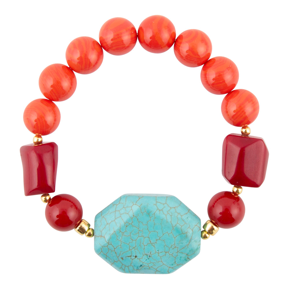 Bracelet with red beads and a turquoise stone on a white background