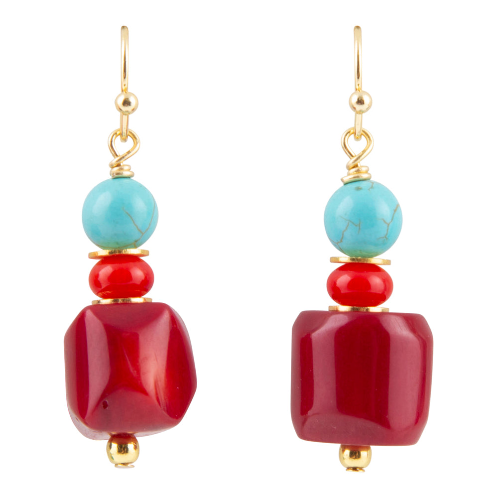 Pair of earrings with red and turquoise beads on a white background