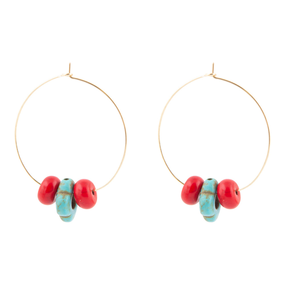 Gold hoop earrings with red and turquoise beads on a white background