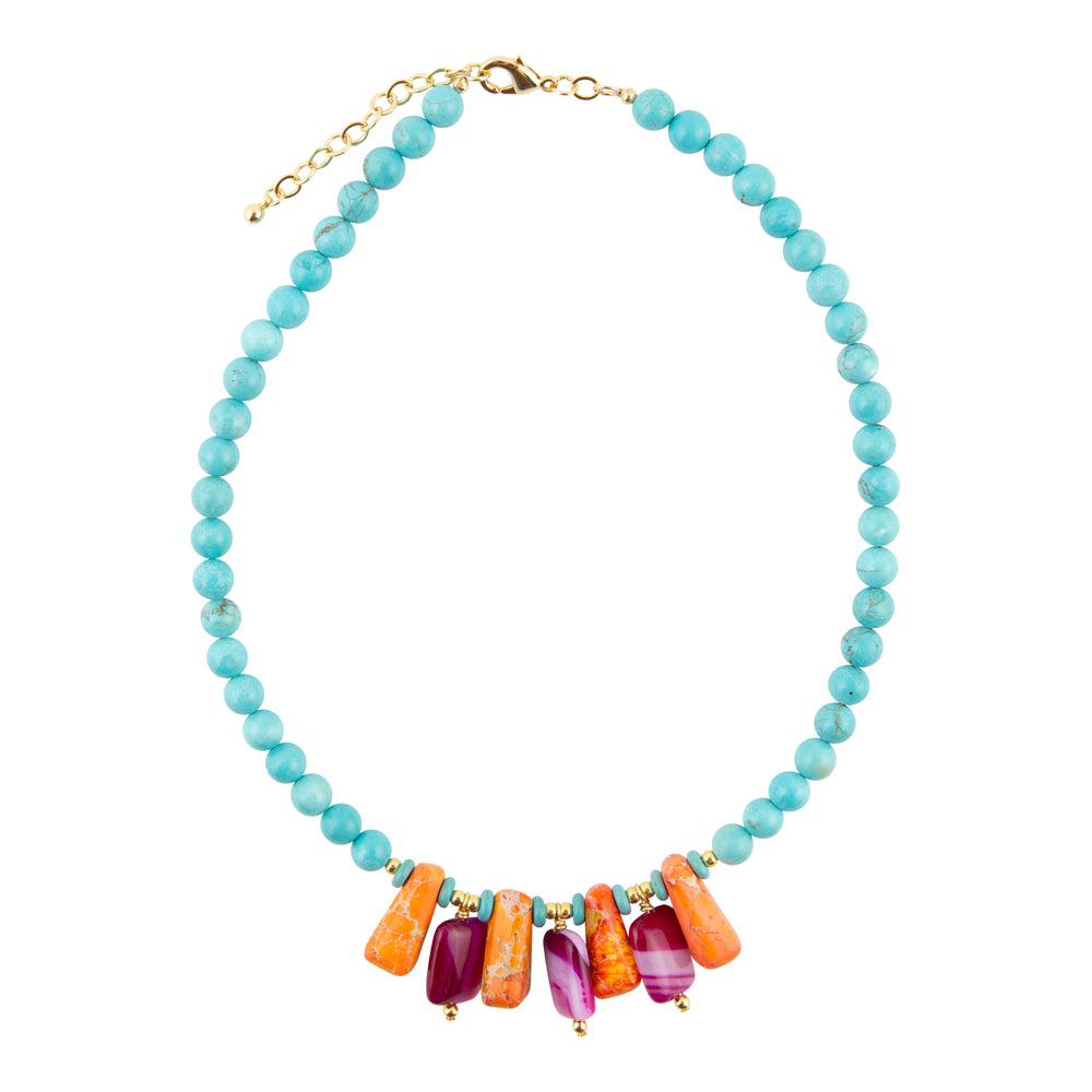 Necklace with blue beads and colorful bar charms on a white background