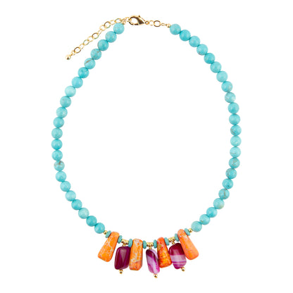 Necklace with blue beads and colorful bar charms on a white background