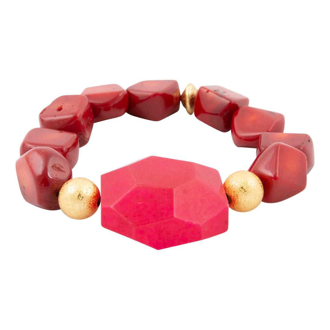 Bracelet with red geometric beads and gold accents on a white background