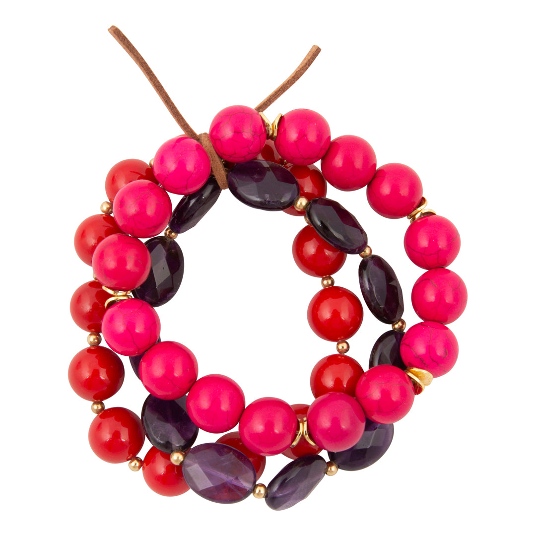 Beaded wreath with pink, red, and purple beads on a white background
