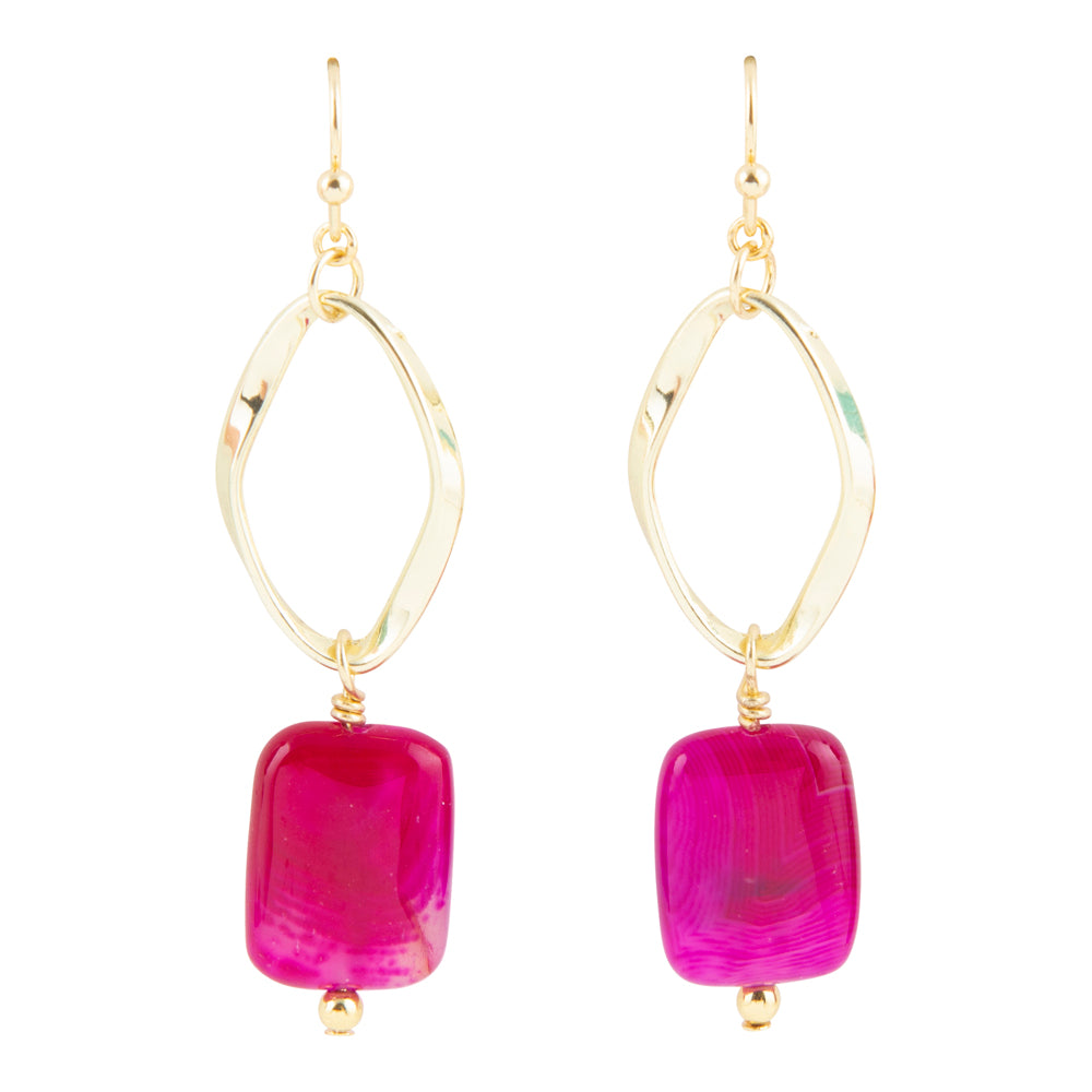 Gold hoop earrings with pink rectangular beads on a white background