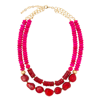Necklace with pink and red beads on a white background