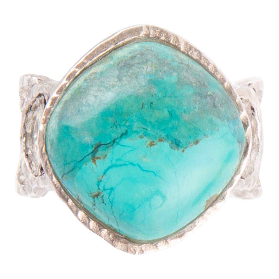 Turquoise ring with silver band on a white background