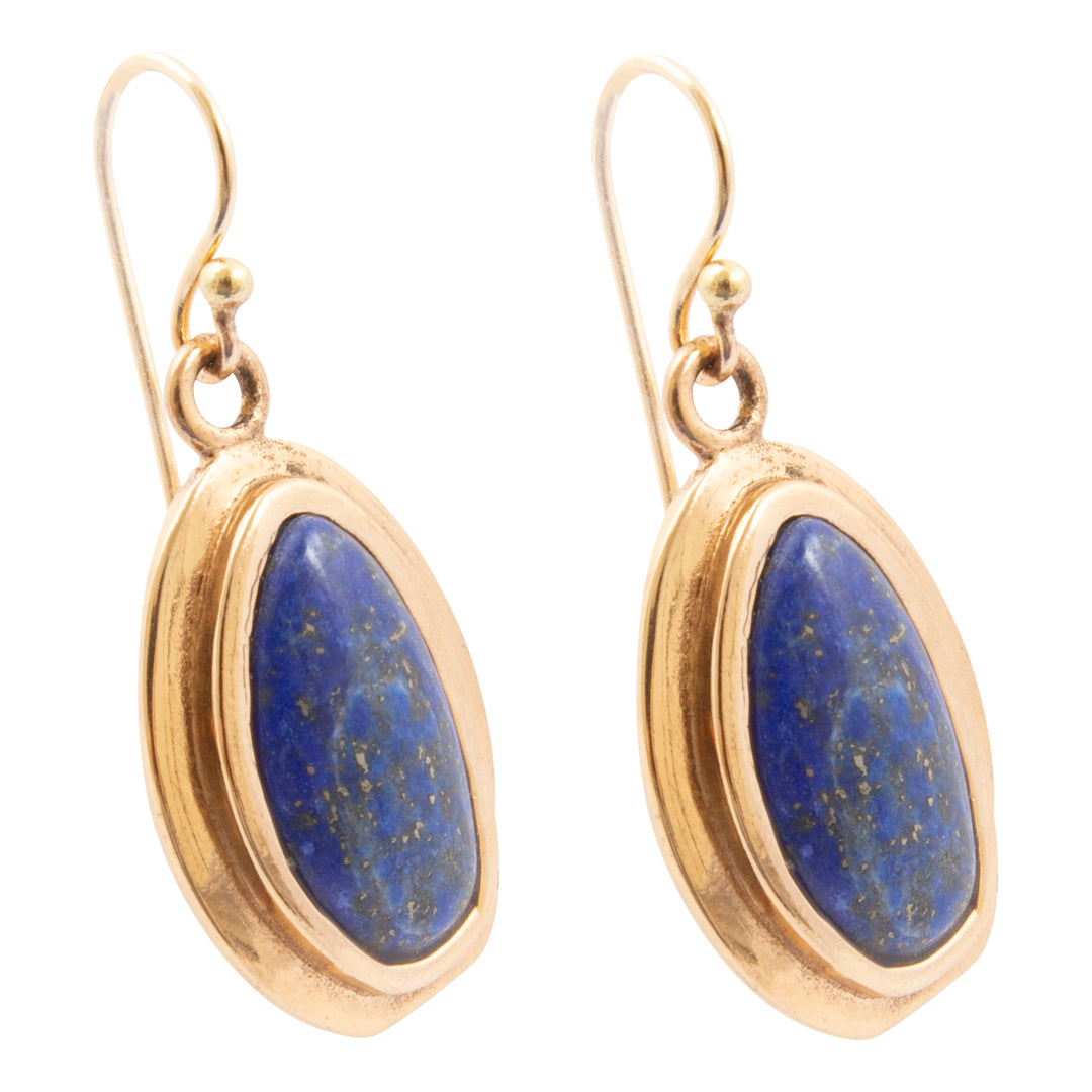 Gold earrings with blue stones on a white background