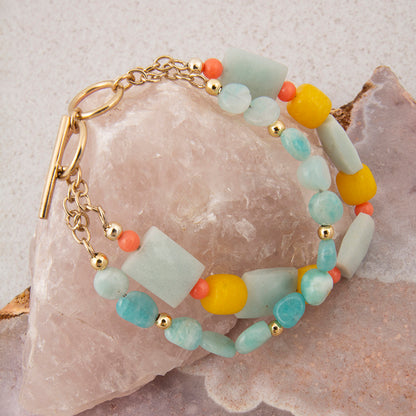 Multicolored beaded bracelet on a stone surface