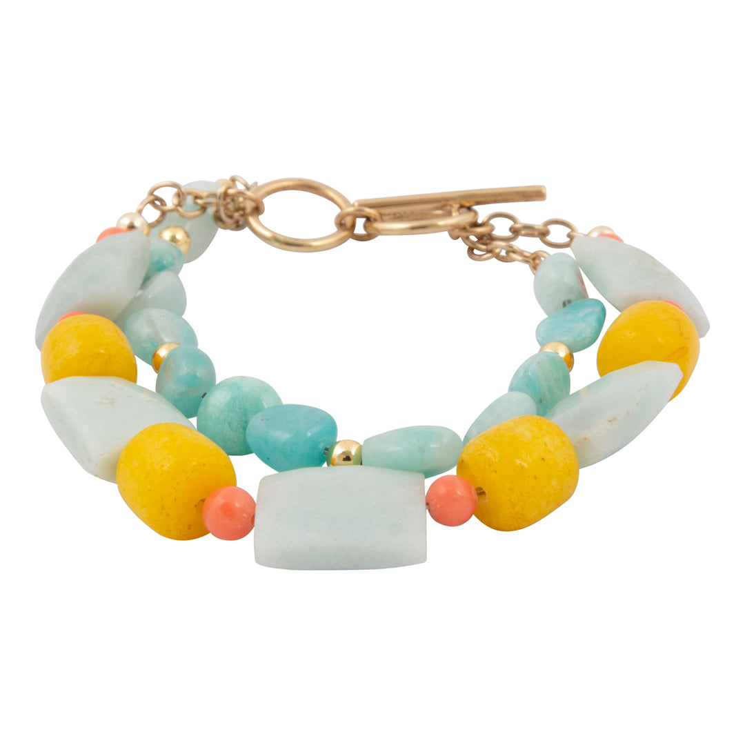 Multicolored beaded bracelet with a gold clasp on a white background
