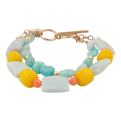 Multicolored beaded bracelet with a gold clasp on a white background