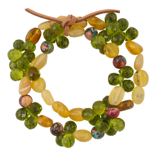 Beaded wreath with green, yellow, and brown beads on a white background