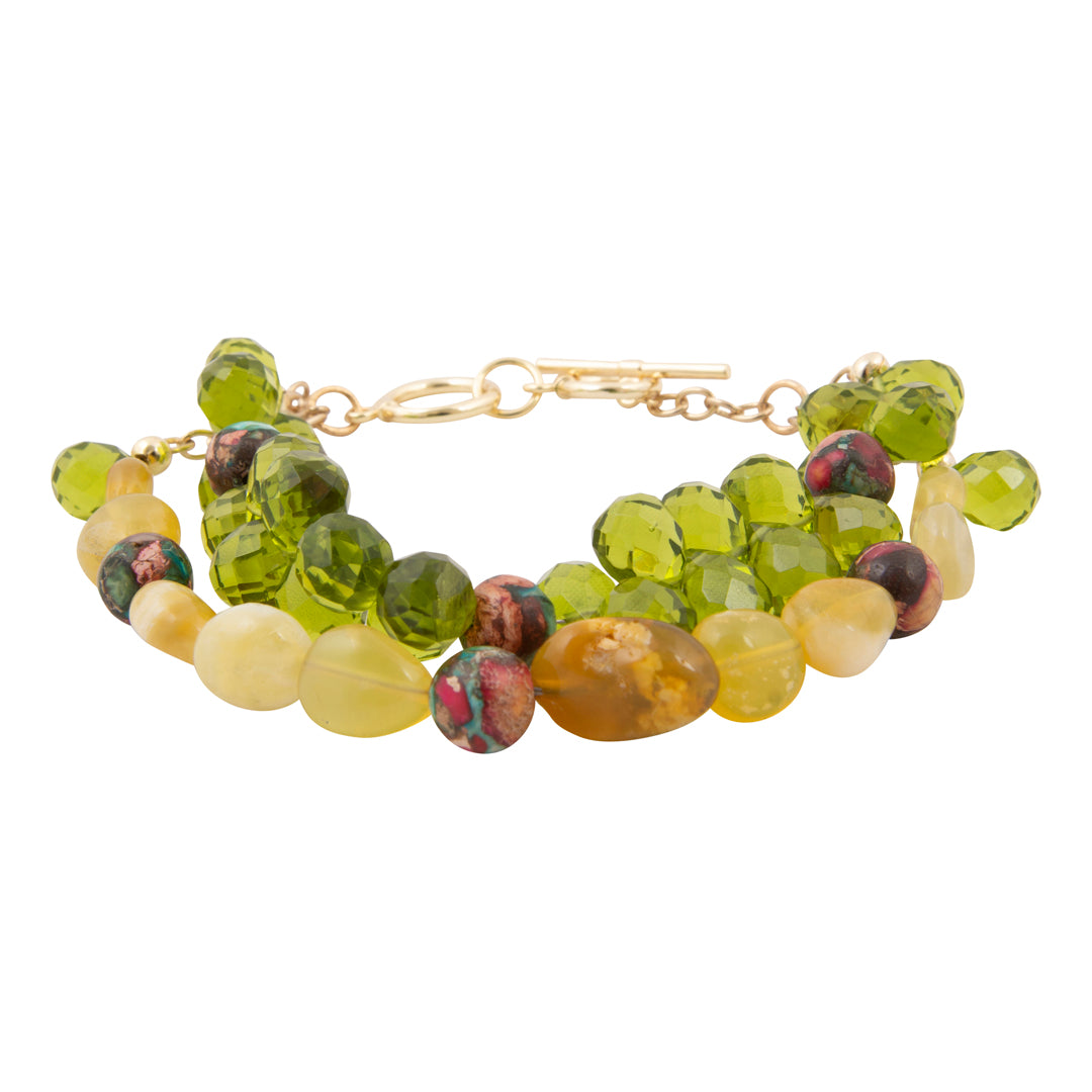 Beaded bracelet with green and yellow beads on a white background