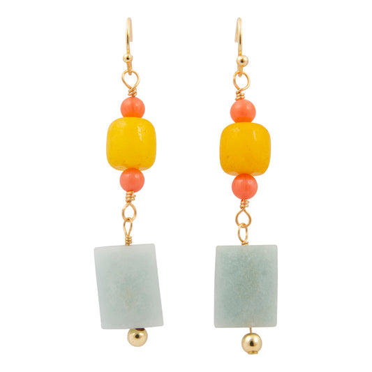 Pair of earrings with yellow, pink, and green beads on a white background