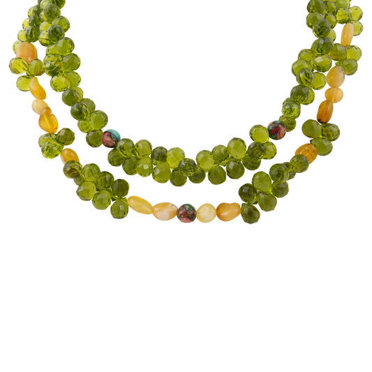Two green beaded necklaces on a white background