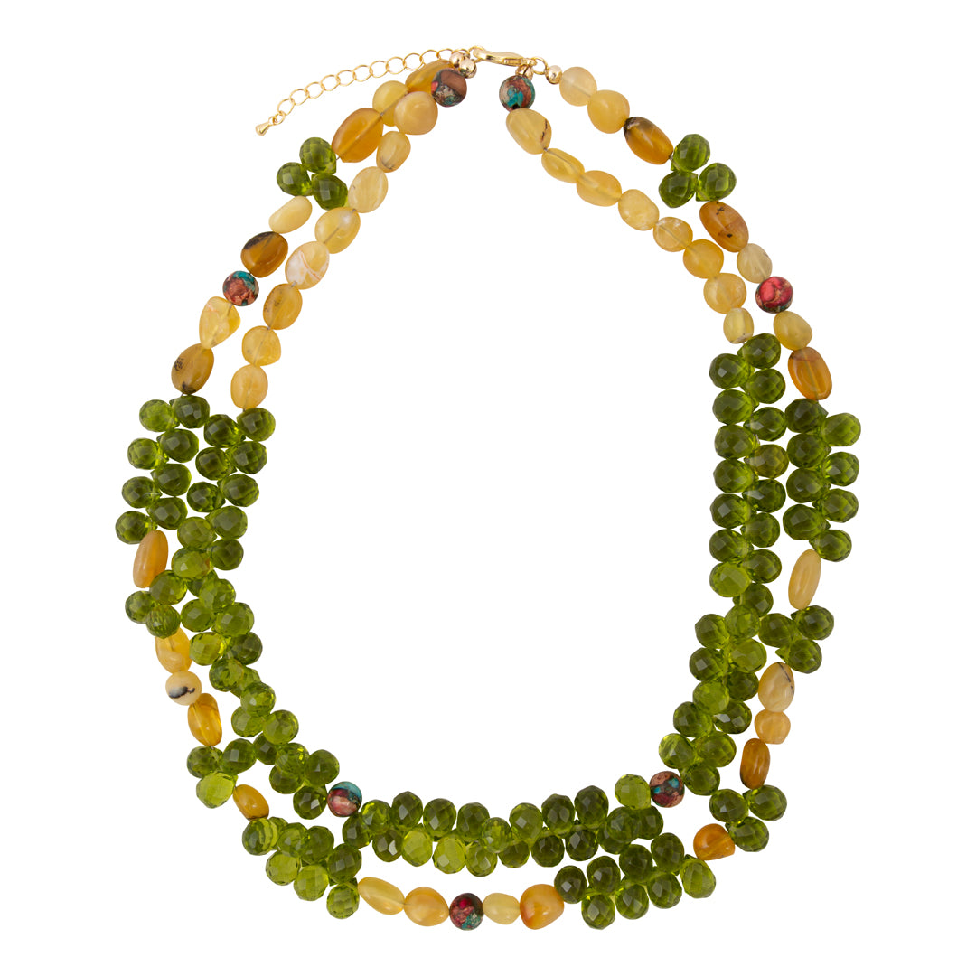 Multistrand necklace with green and yellow beads on a white background